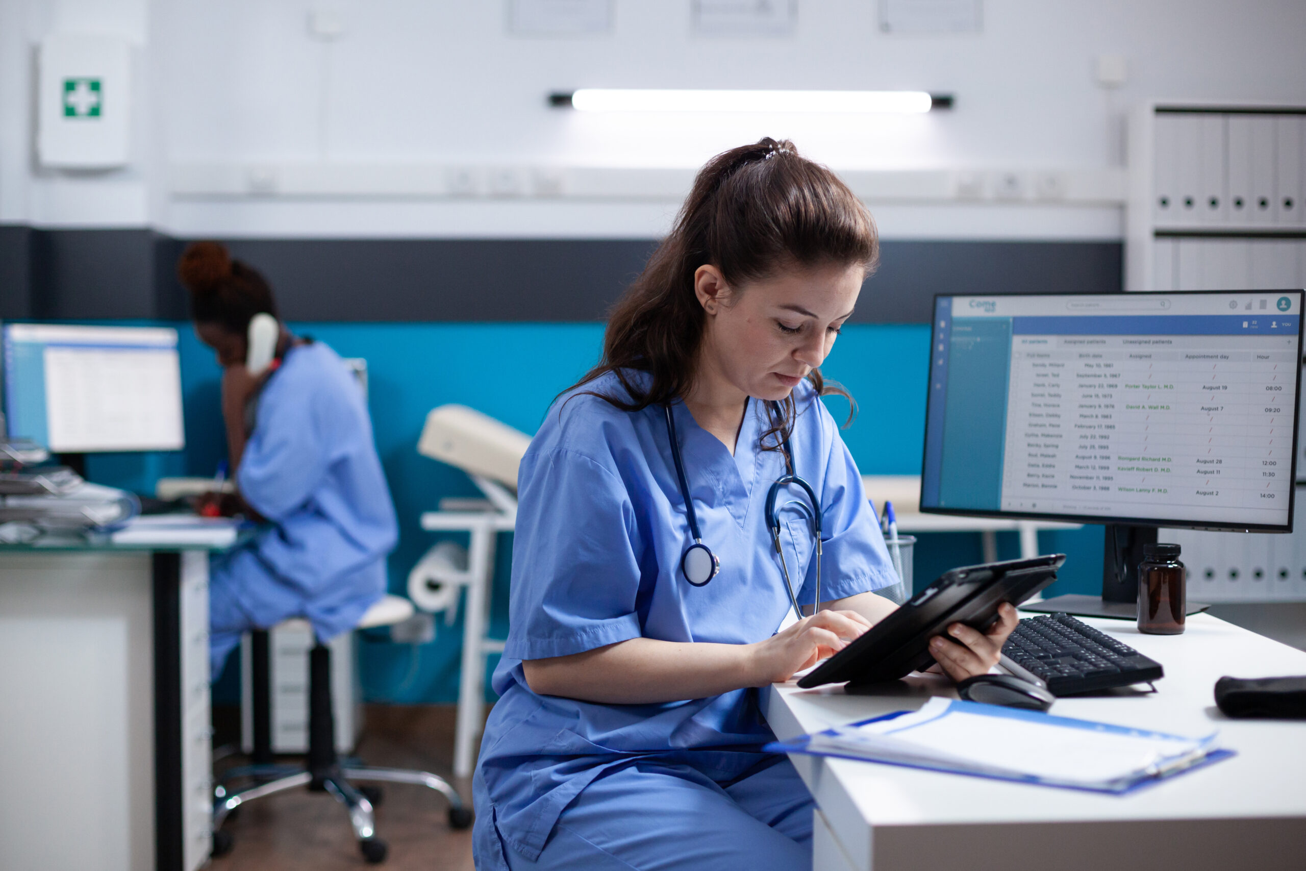 Young nurse reviewing data in the hospital office.